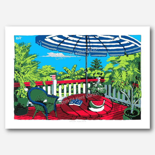 "Open timber deck with tropical garden views, a chair and table under umbrella, a coffee and book and watermelon."