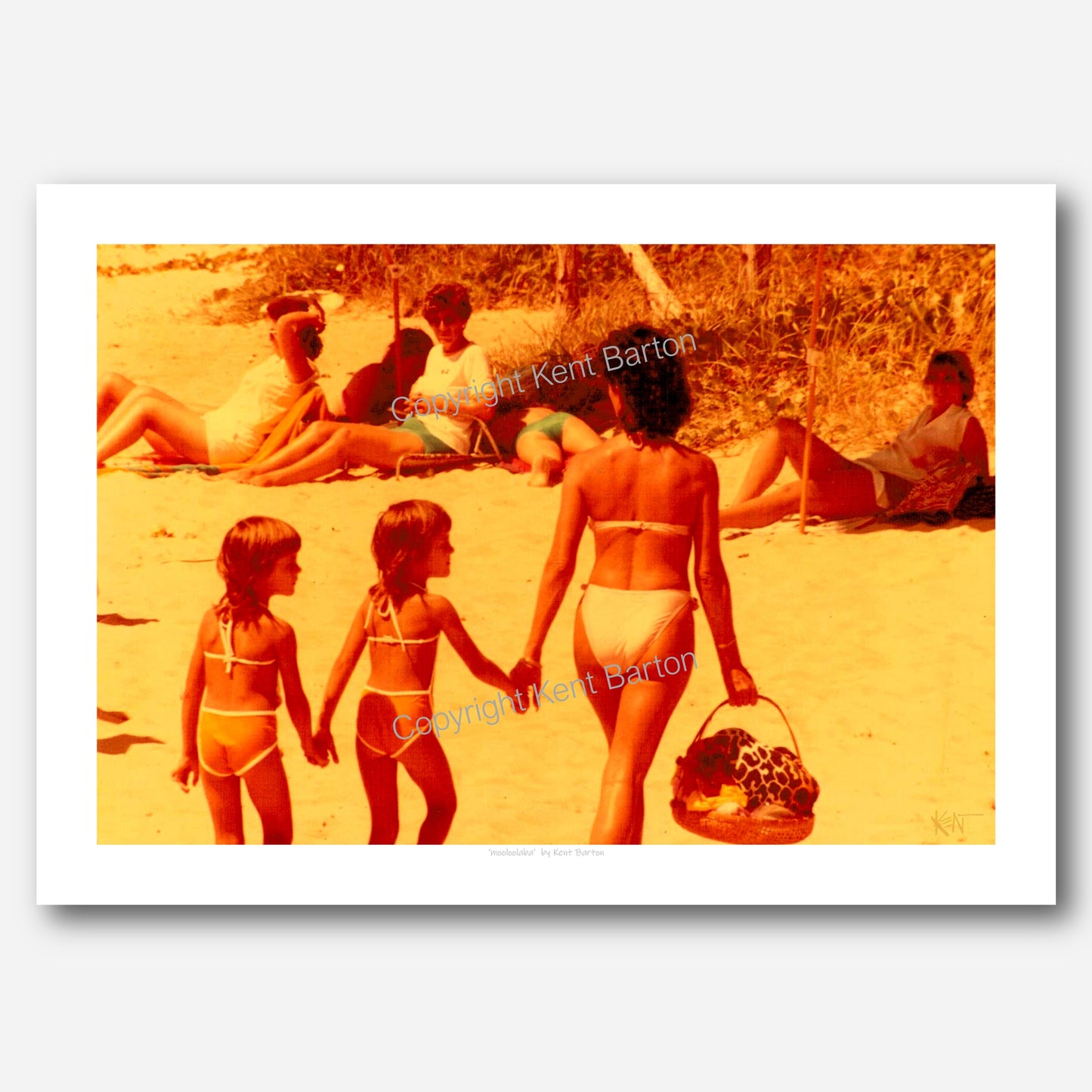 "Mother and two twin daughters draw attention as the walk along the beach in the 80s on the Sunshine Coast."