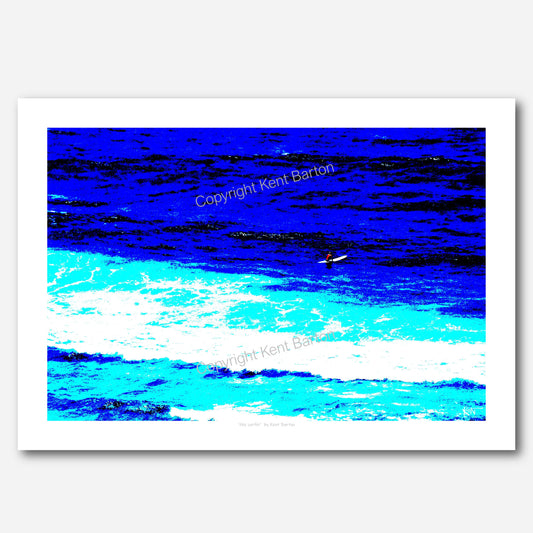 "an overhead view of a surfer sitting on his surfboard surrounded by the ocean."