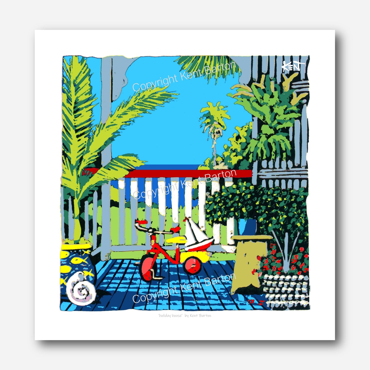 "A tricycle with toy sail boat on a veranda with ocean view."
