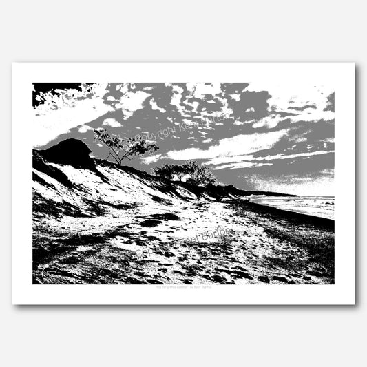 "A black and white picture of a long beach."